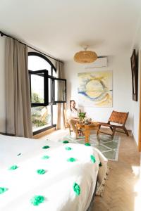 Кровать или кровати в номере RIAD OASIS D'ASILAH