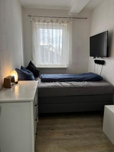 Postel nebo postele na pokoji v ubytování Alpenblick - Zentralgelegene 2-Zimmer-Wohnung