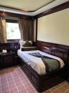 a bedroom with a large bed in a room at الباخرة ريفر بوت river boat in Cairo