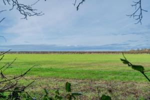 a large open field of green grass with a blue sky at 5 Bedroom Detached House in Milton Keynes in Bletchley