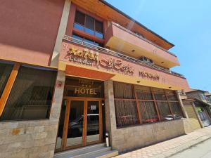 a building with a hotel on a street at Family Hotel Jeri in Velingrad