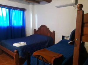 En eller flere senge i et værelse på cabaña huguito y vane