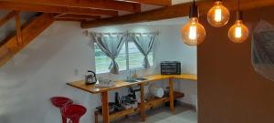 a kitchen with a sink and a window at Casa Juani in Quequén