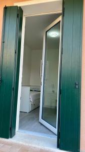 an open door to a room with a sliding glass door at Villa Maragno vicino Abano Terme in Padova +29 photos