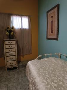Postel nebo postele na pokoji v ubytování Hospedaje Barato Mi Casita de Colores