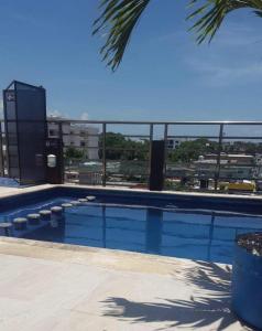 a swimming pool with a view of a city at Condo Marena in Playa del Carmen