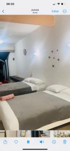 a hotel room with two beds in a room at Condo Marena in Playa del Carmen +19 photos