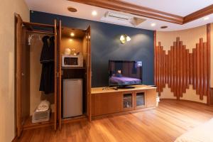 ホテルふらのヴェルデにあるテレビまたはエンターテインメントセンター