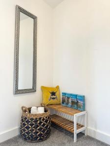 a mirror and a bench in a room at The Courtyard, 4 - Bed, Sleeps 6, Pets Welcome in Ulverston +33 photos