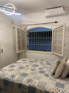 Postel nebo postele na pokoji v ubytování Casa 150m da Praia Martim de Sá