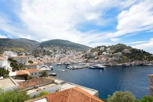 a view of a harbor with boats in the water at Theodora's House in Hydra