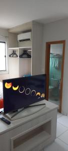 a laptop computer sitting on top of a desk at Flat em Caldas Novas no Golden Dolphin Supreme e próx Shopping Singapura com Utensílios e conforto in Caldas Novas