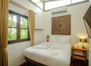 Postel nebo postele na pokoji v ubytování Amaya Boutique Resort