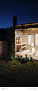 a small house with a backyard at night at Entre Cerros in Maimará