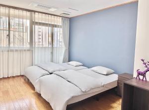 Postel nebo postele na pokoji v ubytování Maria Hotel 宇都宮 + 37 fotografií