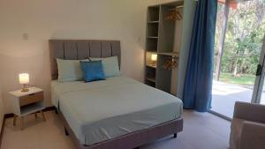 Postel nebo postele na pokoji v ubytování Villas Pura Vida - Mango