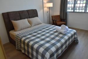 Postel nebo postele na pokoji v ubytování Rain Tree Homestay