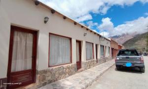 a car parked in front of a building at Tampu 2 alojamiento in Purmamarca