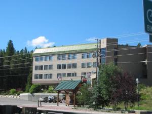 a building with a gazebo in front of a street at Best Ski Condo, Winter Park, USA in Winter Park