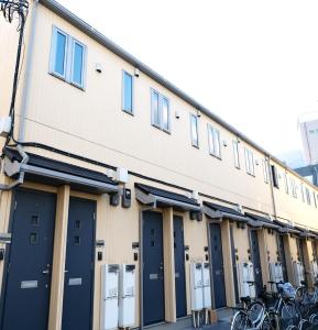 a building with bikes parked outside of it at Belle Lead 206 in Tokyo