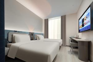 Voodi või voodid majutusasutuse Atour Light Hotel Hangzhou Sijiqing Nanxingqiao Metro Station toas