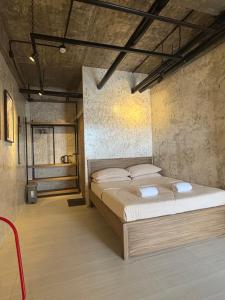 a bedroom with a large bed in a room at Hams Studio 1 in Moises R. Espinosa Airport