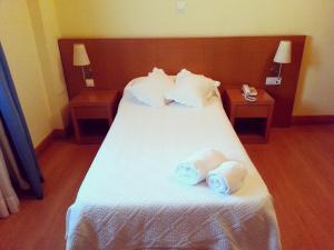 Cama o camas de una habitación en Hotel Ibaigune