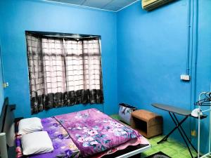 Postel nebo postele na pokoji v ubytování Homestay Pertama