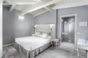 Postel nebo postele na pokoji v ubytování Hotel Nettuno
