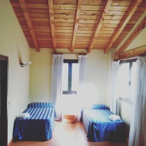 Cama o camas de una habitación en Hotel Ibaigune