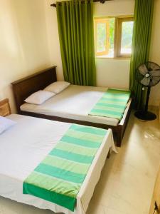 Postel nebo postele na pokoji v ubytování Vintage Rest Anuradhapura + 8 fotografií
