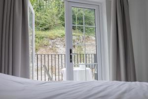 Balkón nebo terasa v ubytování Rock Mill Retreat