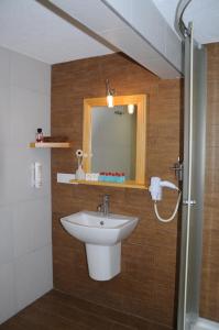 a bathroom with a sink and a mirror at Butik Pendik Hotel in Istanbul