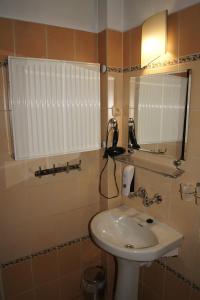 a bathroom with a sink and a mirror at Róża in Szklarska Poręba