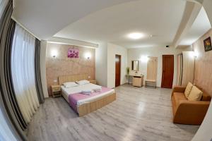 Postel nebo postele na pokoji v ubytování Hotel Coralis