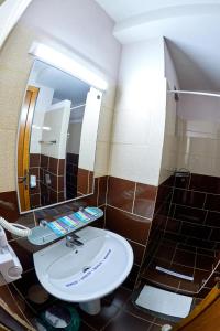 Koupelna v ubytování Hotel Coralis