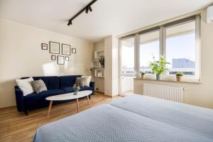 Posteľ alebo postele v izbe v ubytovaní Gama Home Kondratowicza18