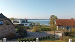 arial view of a house with a lake in the background at Haus Seeblick in Alt Schwerin