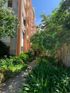 a walkway in front of a building at Paseo Verde Daily Staycation in Manila +18 photos
