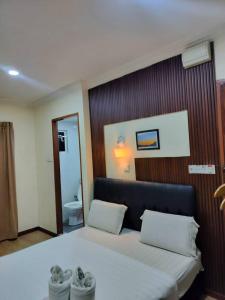 Postel nebo postele na pokoji v ubytování Alonto Hotel