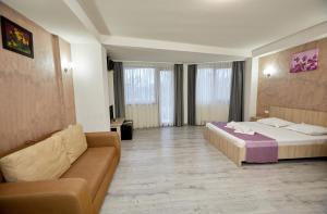 Postel nebo postele na pokoji v ubytování Hotel Coralis