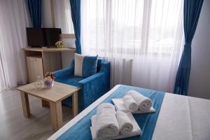Postel nebo postele na pokoji v ubytování Hotel Coralis