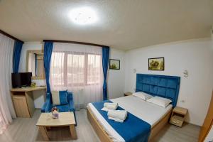 Postel nebo postele na pokoji v ubytování Hotel Coralis