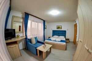 TV a/nebo společenská místnost v ubytování Hotel Coralis