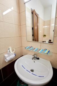 Koupelna v ubytování Hotel Coralis