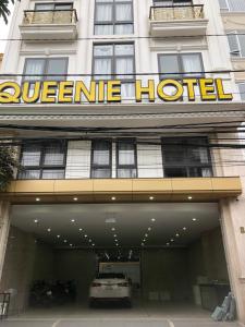 a hotel with a car parked in front of it at Queenie Hotel in Hai Phong