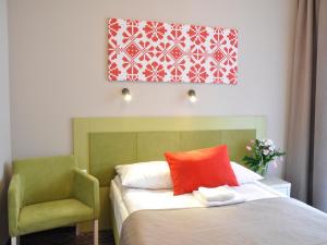 Łóżko lub łóżka w pokoju w obiekcie Hotel *** NAT Krynica Zdrój