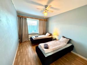 Ένα ή περισσότερα κρεβάτια σε δωμάτιο στο DP Apartments Vaasa III