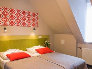 Łóżko lub łóżka w pokoju w obiekcie Hotel *** NAT Krynica Zdrój