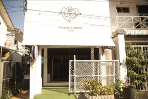 a building with a white awning over the door at Friend's House Arak in Chiang Mai